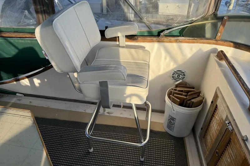 Slide: The Image of Captain's chair on 1981 Marine Trader Double Cabin boat deck. - 43