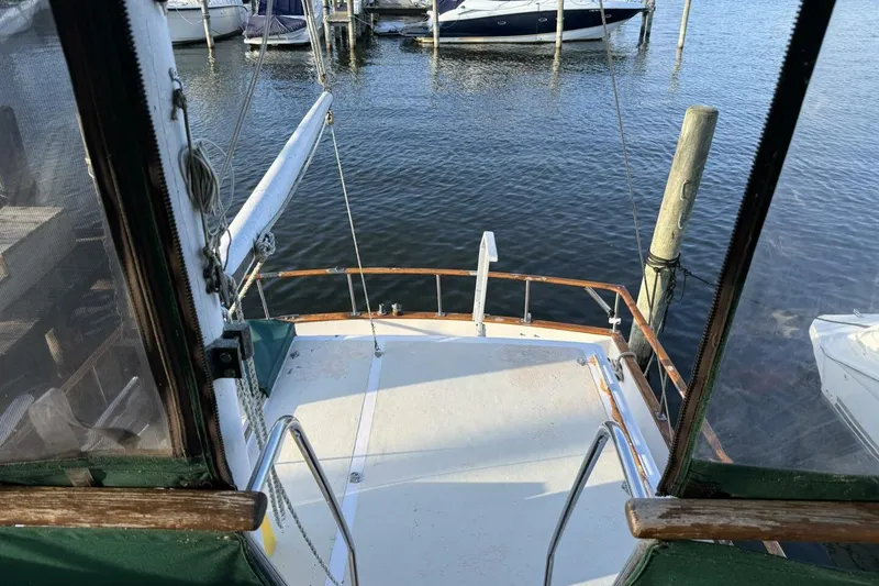 Slide: The Image of 1981 Marine Trader Double Cabin boat deck overlooking marina with moored boats. - 45