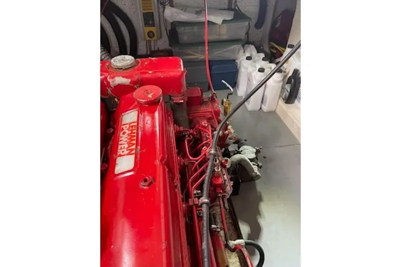 Slide: The Image of Red Lehman Power engine in a 1981 Marine Trader Double Cabin boat. - 49
