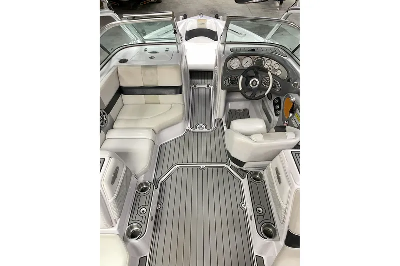 Slide: The Image of 2007 Nautique Super Air Nautique 220 interior with sleek seating and modern dashboard design. - 3