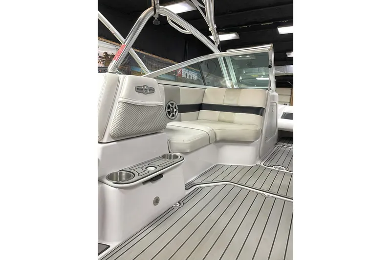 Slide: The Image of 2007 Nautique Super Air Nautique 220 interior with white seating and sleek design. - 4