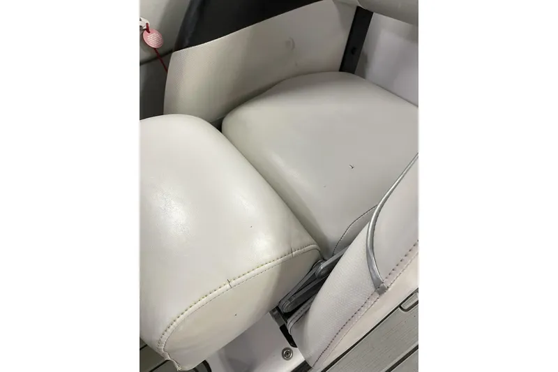 Slide: The Image of 2007 Nautique Super Air Nautique 220 boat seat, white upholstery, close-up view. - 7