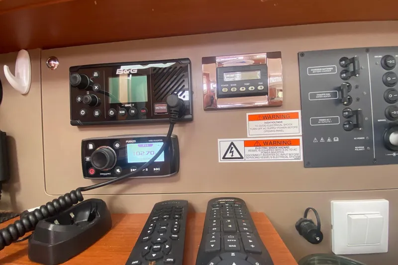 Slide: The Image of Control panel of a 2016 Beneteau Oceanis 35 sailboat with navigation and communication equipment. - 22