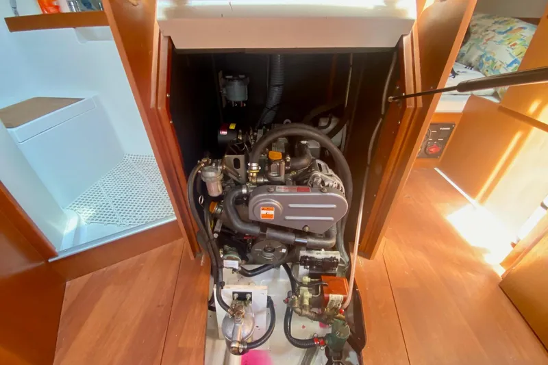Slide: The Image of Engine compartment of a 2016 Beneteau Oceanis 35 sailboat, showcasing mechanical components. - 25