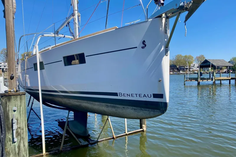 Slide: The Image of 2016 Beneteau Oceanis 35 sailboat docked, side view, on a sunny day. - 32
