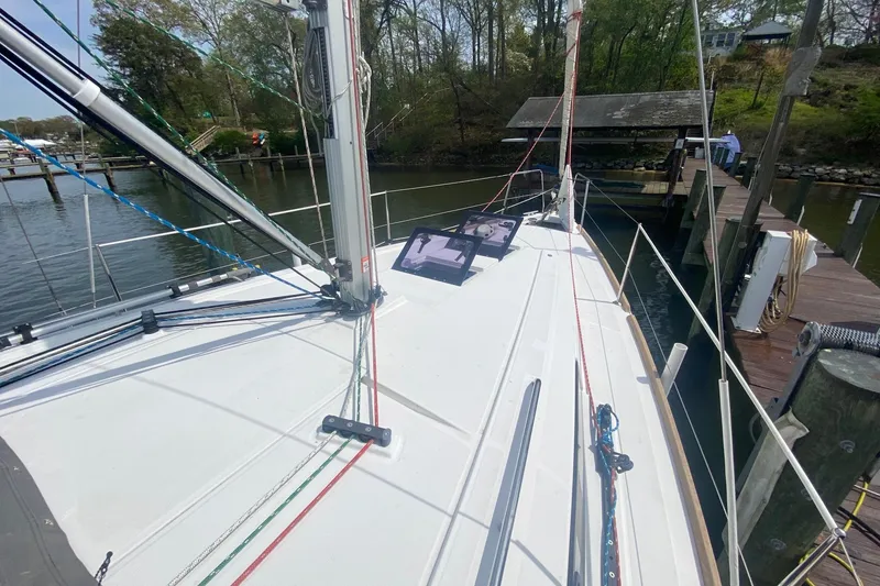 Slide: The Image of 2016 Beneteau Oceanis 35 sailboat docked, showcasing deck and rigging details. - 35