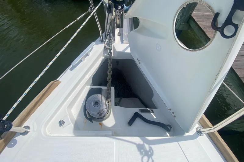 Slide: The Image of Anchor locker of a 2016 Beneteau Oceanis 35 sailboat, open with visible chain. - 36