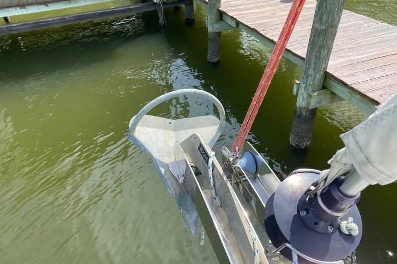 Slide: The Image of Bow of 2016 Beneteau Oceanis 35 sailboat with anchor and dock view. - 37