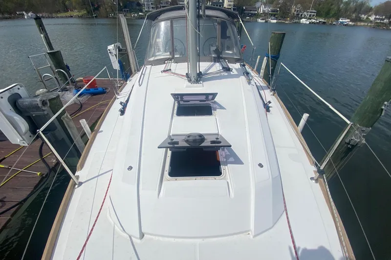 Slide: The Image of 2016 Beneteau Oceanis 35 sailboat docked, showcasing deck and hatch details. - 38