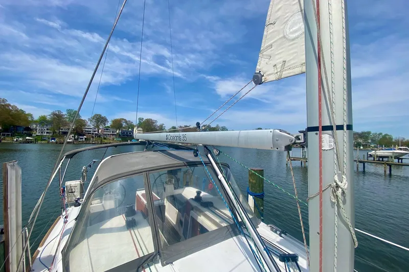 Slide: The Image of 2016 Beneteau Oceanis 35 sailboat docked on a sunny day. - 39