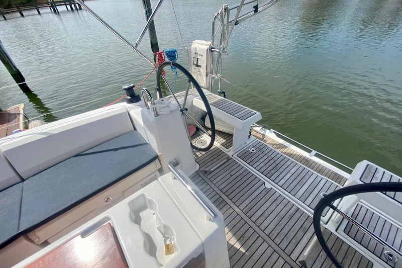 Slide: The Image of Cockpit of 2016 Beneteau Oceanis 35 sailboat with dual steering wheels and teak decking. - 43