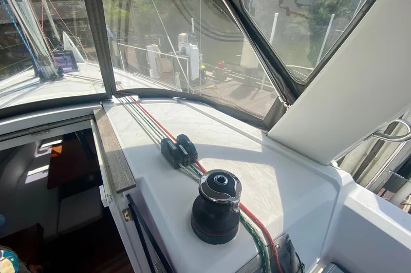 Slide: The Image of Interior view of a 2016 Beneteau Oceanis 35 sailboat, showcasing deck equipment and cabin entrance. - 48