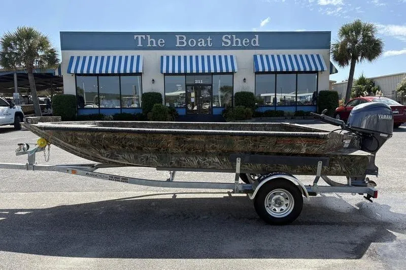 Slide: The Image of 2026 SeaArk 1752 Slayer boat on trailer outside The Boat Shed dealership. - 0