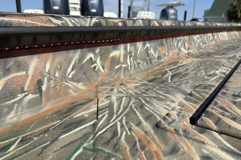 Slide: The Image of 2026 SeaArk 1752 Slayer boat with camouflage pattern and detailed texture. - 16