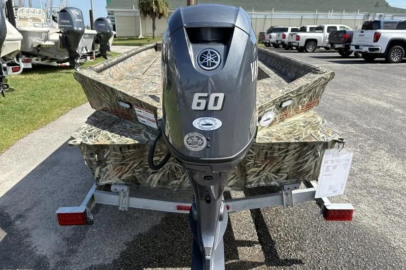 Slide: The Image of 2026 SeaArk 1752 Slayer boat with Yamaha 60 outboard motor on trailer. - 2