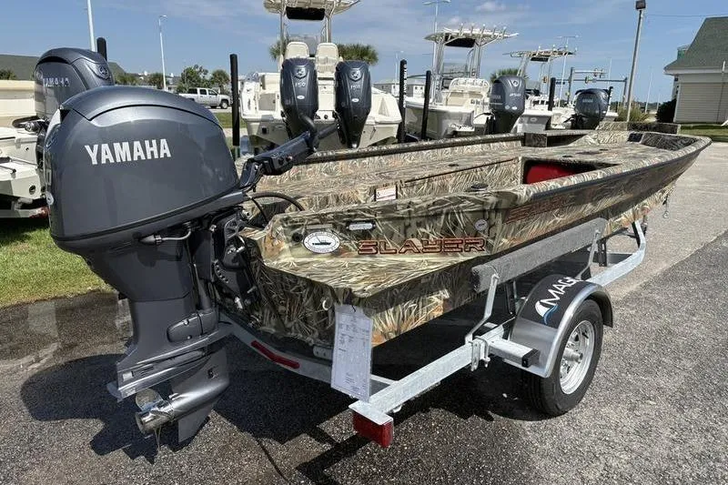 Slide: The Image of 2026 SeaArk 1752 Slayer boat with Yamaha motor on trailer, camo design. - 3