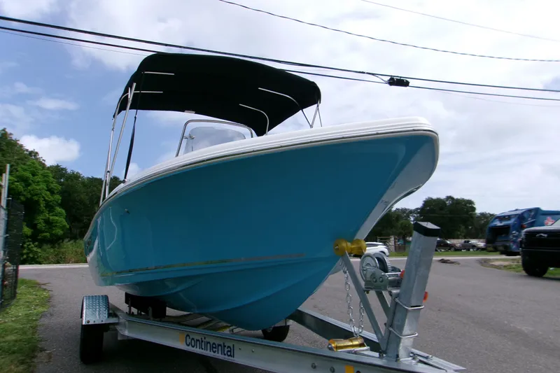Slide: The Image of 2026 Key West 189 FS boat on trailer, blue hull, parked outdoors. - 10