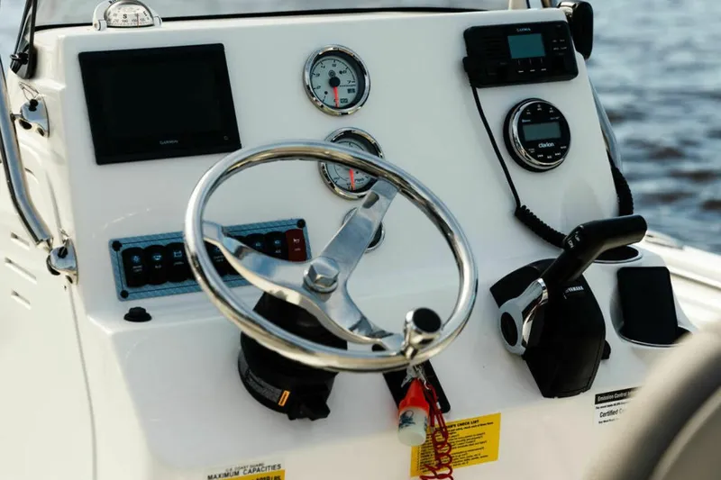 Slide: The Image of Manufacturer Provided Image: Steering console of 2025 Key West 189 FS boat with gauges and controls. - 2
