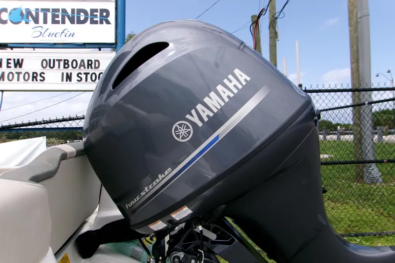 Slide: The Image of Yamaha outboard motor on Key West 189 FS boat, 2026 model, near dealership sign. - 7