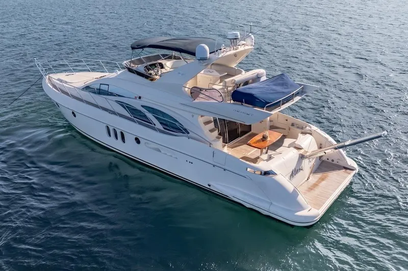 Slide: The Image of Luxurious 2007 Azimut 62 Evolution yacht cruising on open water. - 13