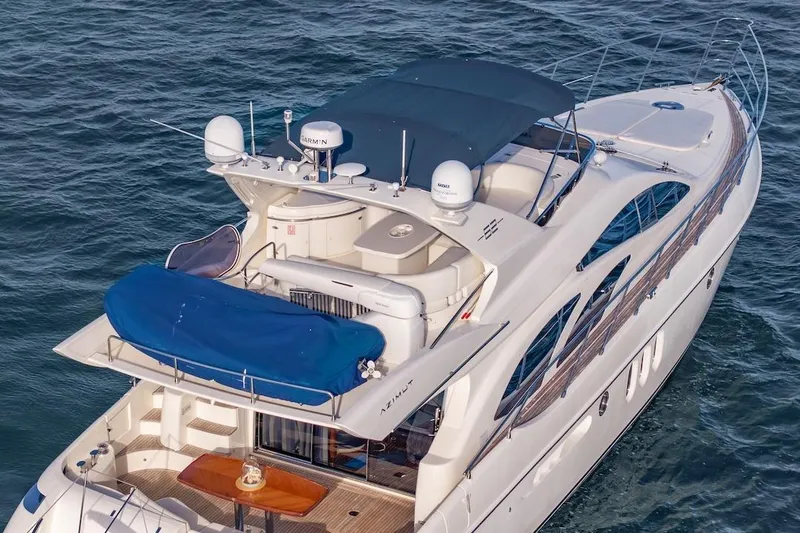Slide: The Image of 2007 Azimut 62 Evolution yacht cruising on open water, showcasing luxury design and amenities. - 16