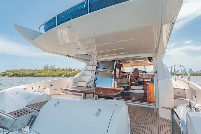 Slide: The Image of 2007 Azimut 62 Evolution yacht with spacious deck and luxurious interior. - 21