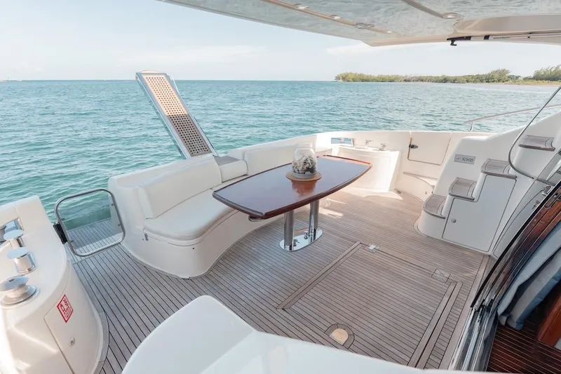Slide: The Image of Luxurious 2007 Azimut 62 Evolution yacht deck with elegant seating and ocean view. - 26