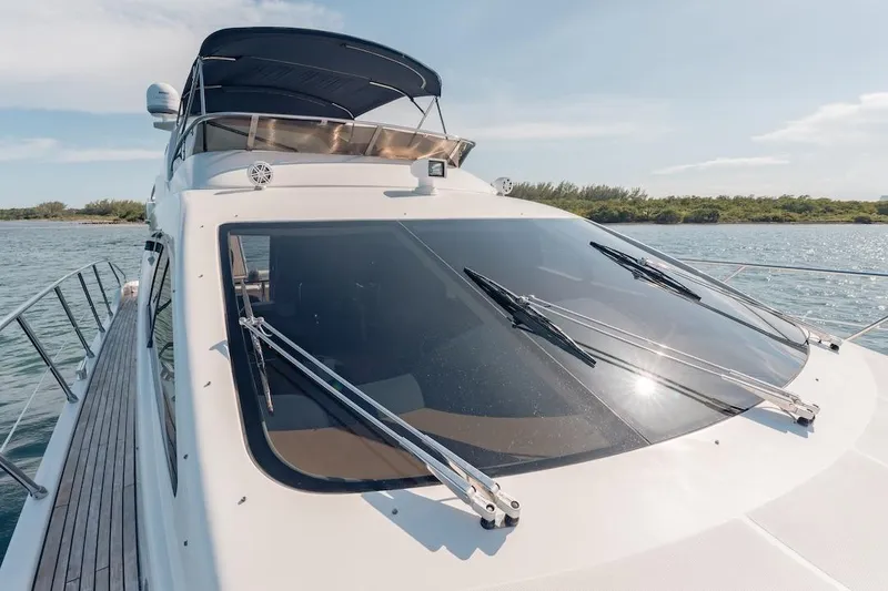 Slide: The Image of 2007 Azimut 62 Evolution yacht on water, sleek design, sunny day. - 32