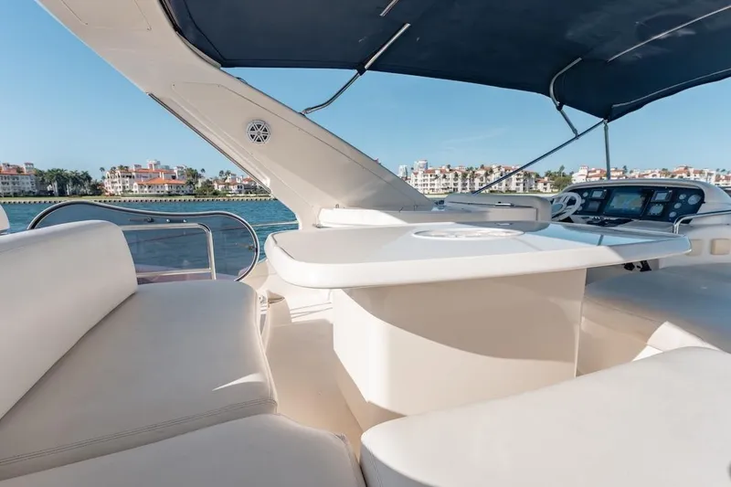 Slide: The Image of Luxurious 2007 Azimut 62 Evolution yacht deck with seating and ocean view. - 36
