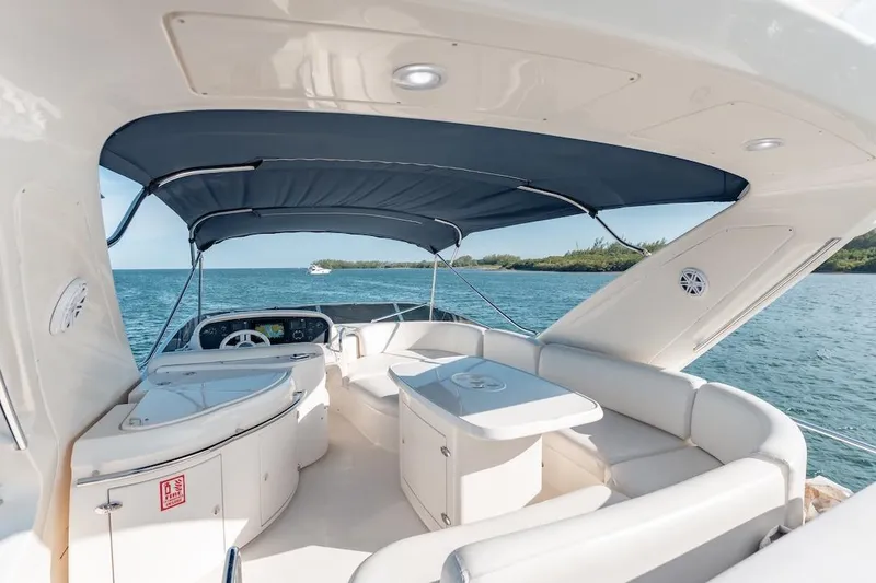 Slide: The Image of Luxurious 2007 Azimut 62 Evolution yacht interior with elegant seating and ocean view. - 37
