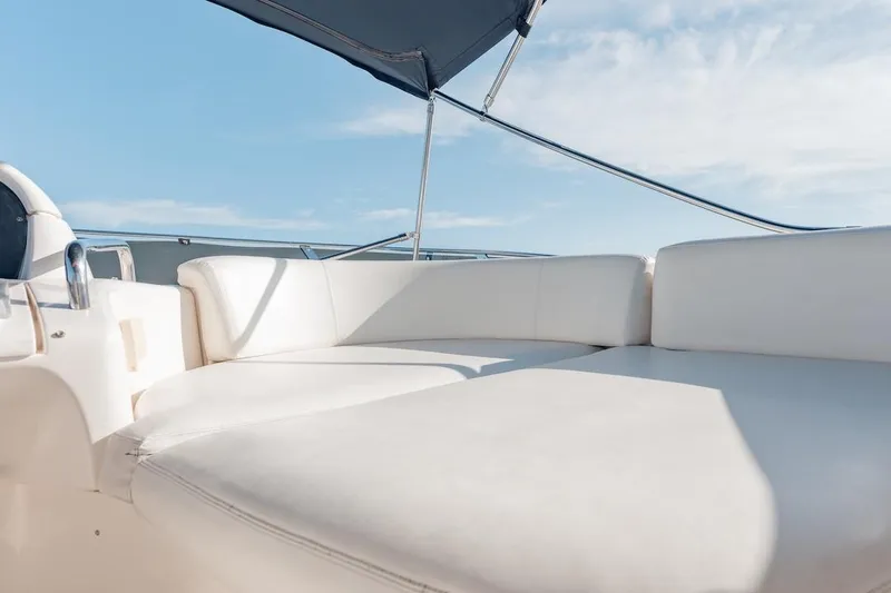 Slide: The Image of Luxurious seating on 2007 Azimut 62 Evolution yacht under clear blue sky. - 40