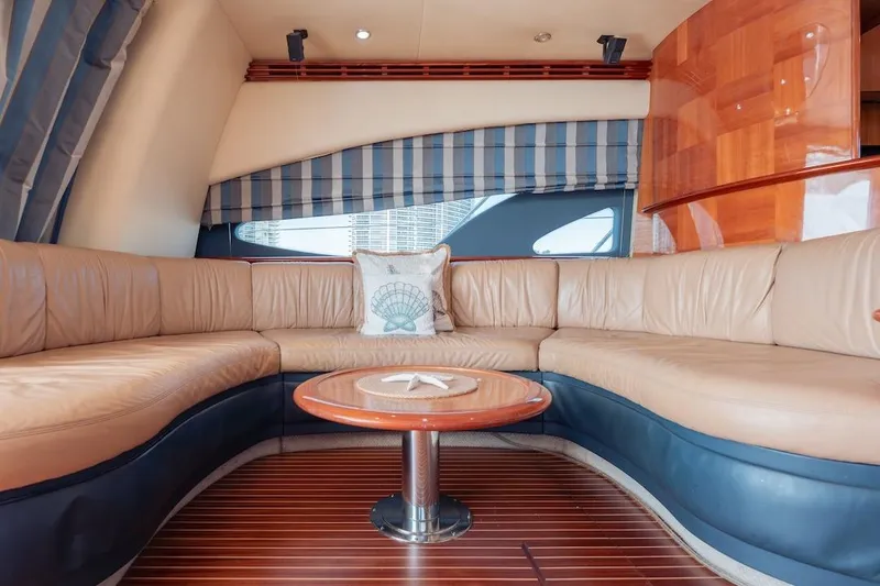 Slide: The Image of Luxurious interior of 2007 Azimut 62 Evolution yacht with leather seating and wooden accents. - 48