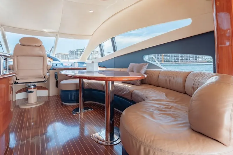 Slide: The Image of Luxurious interior of a 2007 Azimut 62 Evolution yacht with plush seating and elegant design. - 52