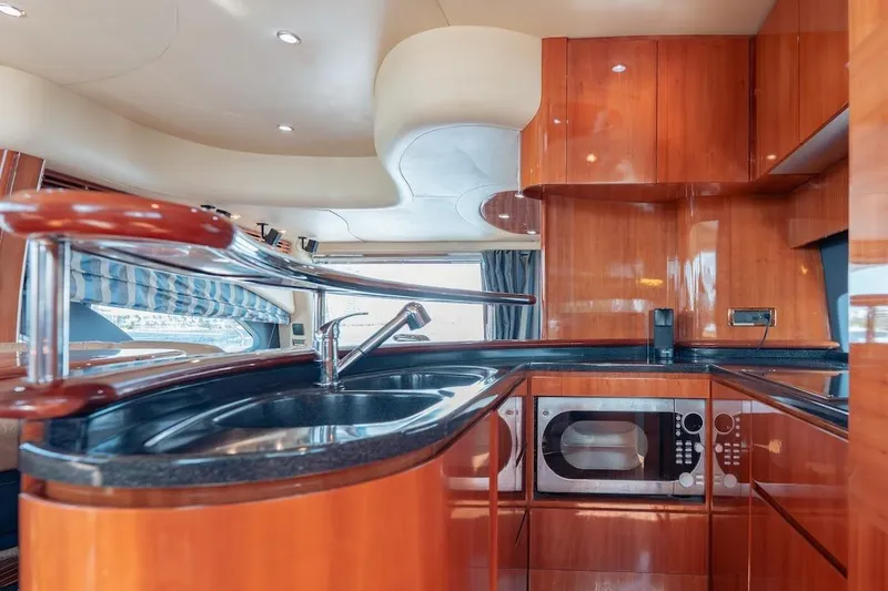 Slide: The Image of Luxurious kitchen interior of 2007 Azimut 62 Evolution yacht with modern amenities. - 55