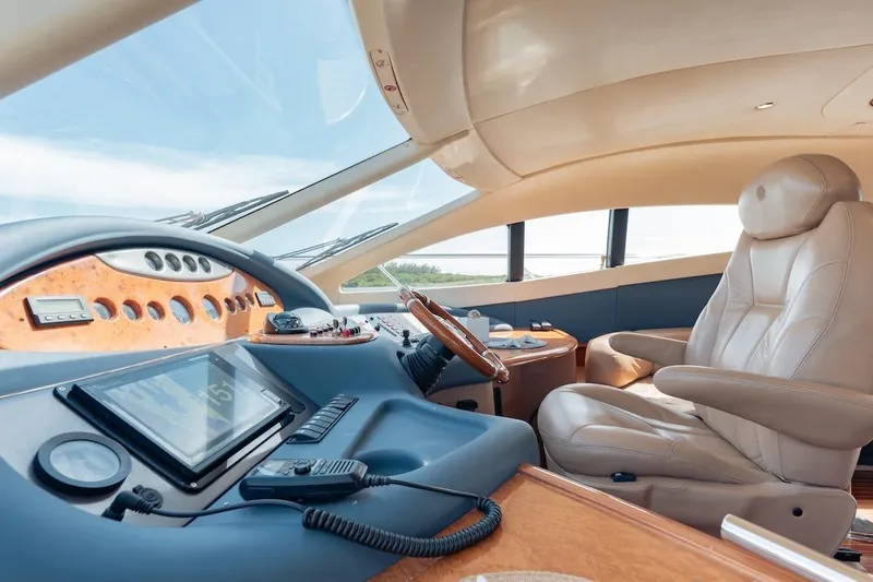 Slide: The Image of Luxurious 2007 Azimut 62 Evolution yacht cockpit with leather seating and advanced navigation controls. - 56