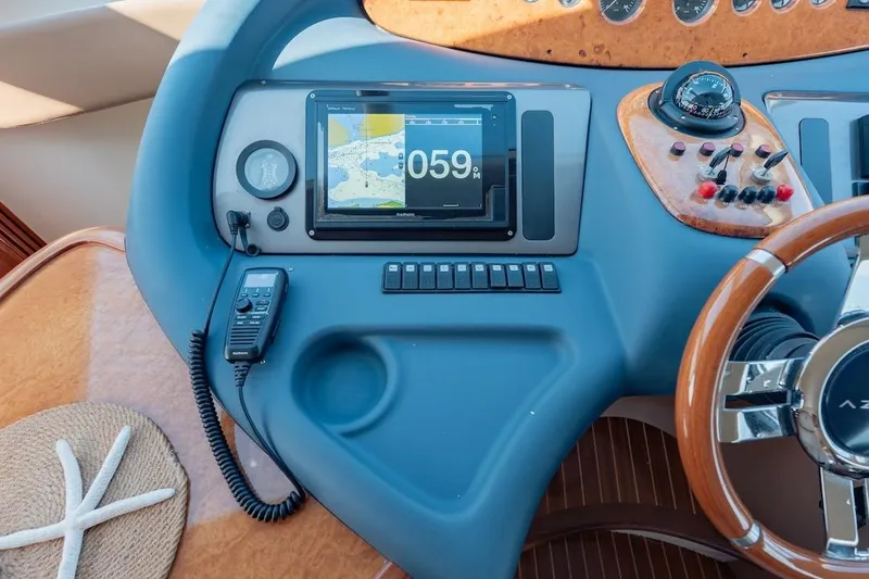 Slide: The Image of Control panel of a 2007 Azimut 62 Evolution yacht with navigation display. - 57