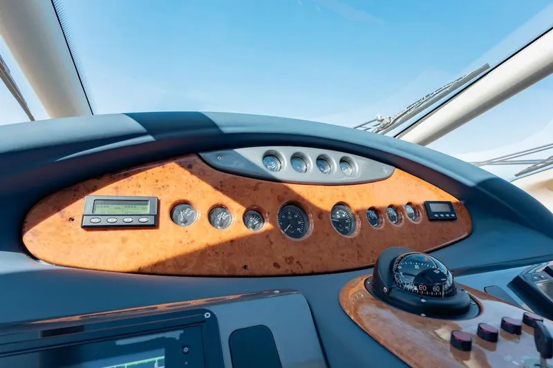 Slide: The Image of Control panel of 2007 Azimut 62 Evolution yacht with gauges and compass. - 58