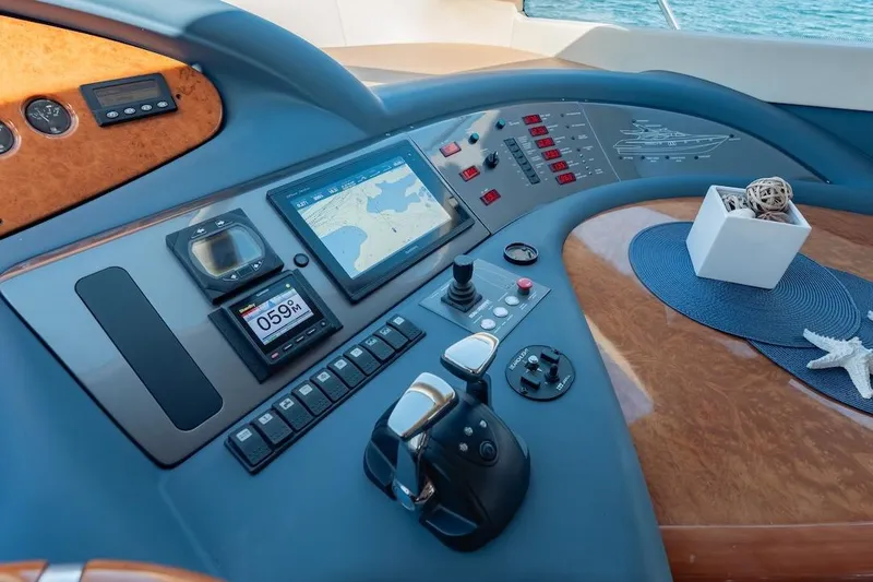 Slide: The Image of Control panel of 2007 Azimut 62 Evolution yacht with navigation display and controls. - 59
