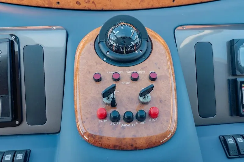 Slide: The Image of Control panel of a 2007 Azimut 62 Evolution yacht with compass and switches. - 60