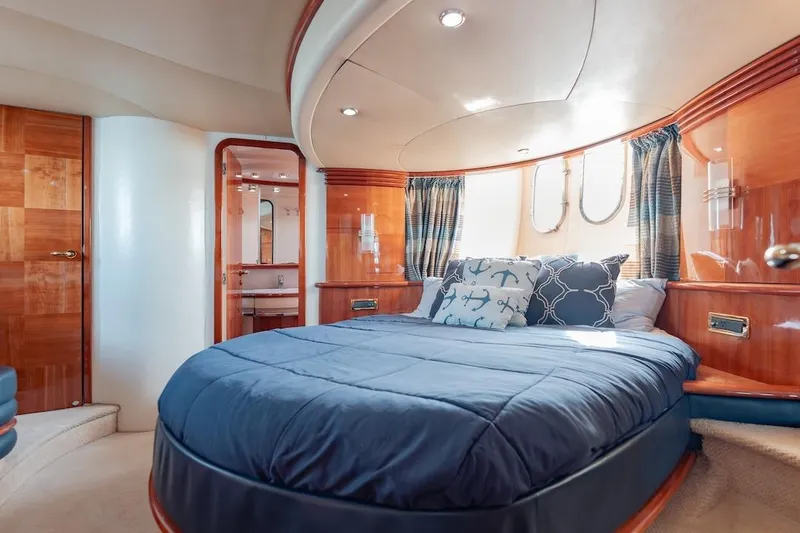 Slide: The Image of Luxurious bedroom interior of 2007 Azimut 62 Evolution yacht with elegant wood finishes. - 61