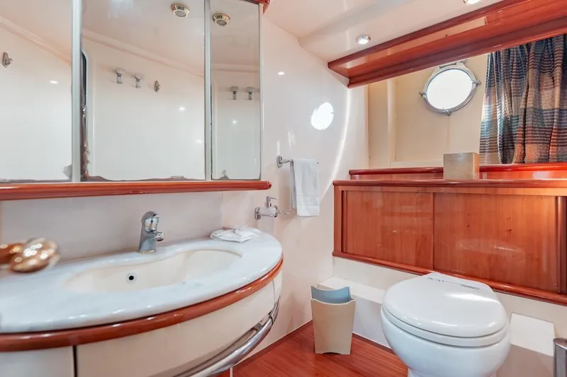 Slide: The Image of Luxurious bathroom in 2007 Azimut 62 Evolution yacht with elegant wood accents and modern fixtures. - 64