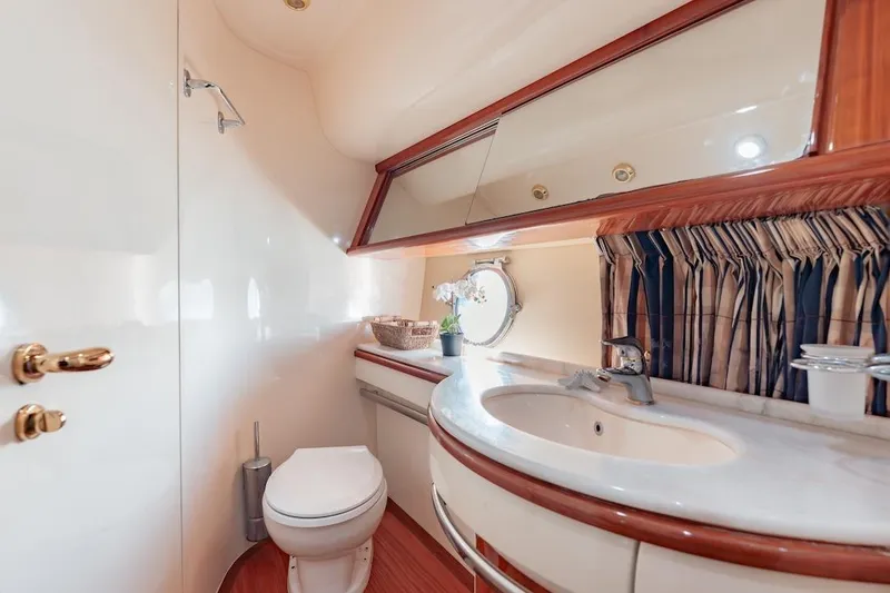 Slide: The Image of Luxurious bathroom in 2007 Azimut 62 Evolution yacht with elegant fixtures and porthole window. - 66