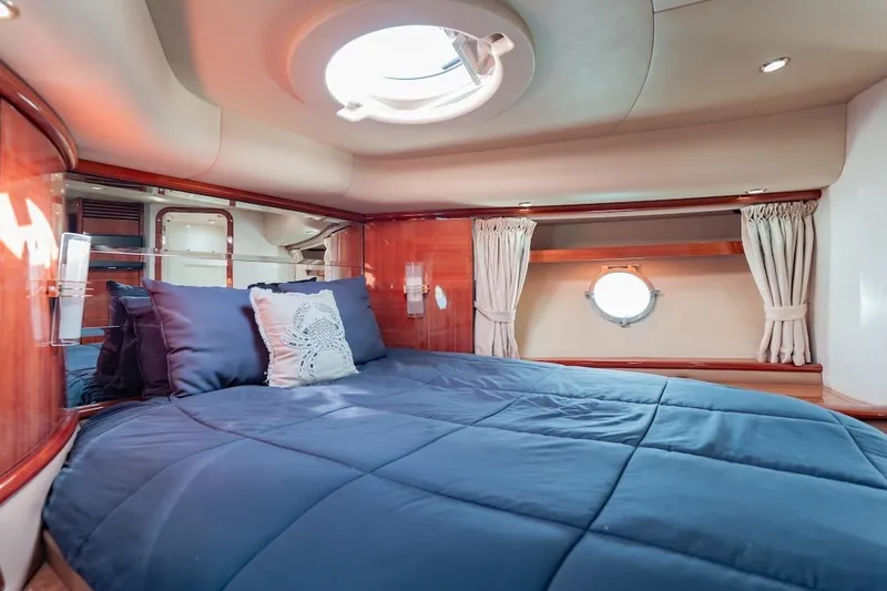 Slide: The Image of Luxurious cabin interior of 2007 Azimut 62 Evolution yacht with blue bedding. - 69