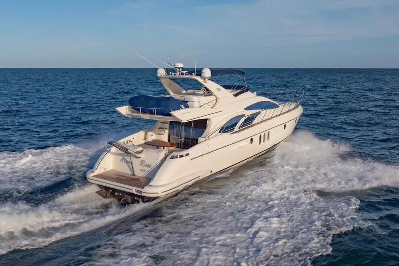 Slide: The Image of 2007 Azimut 62 Evolution yacht cruising on open sea, rear view. - 7