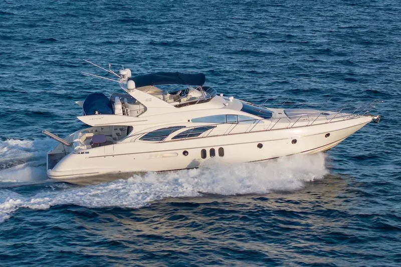 Slide: The Image of 2007 Azimut 62 Evolution yacht cruising on open water. - 8