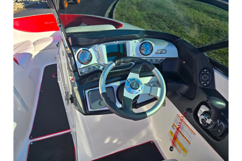 Slide: The Image of 2012 Sea-Doo Sport Boats 210 Wake dashboard with steering wheel and controls. - 12