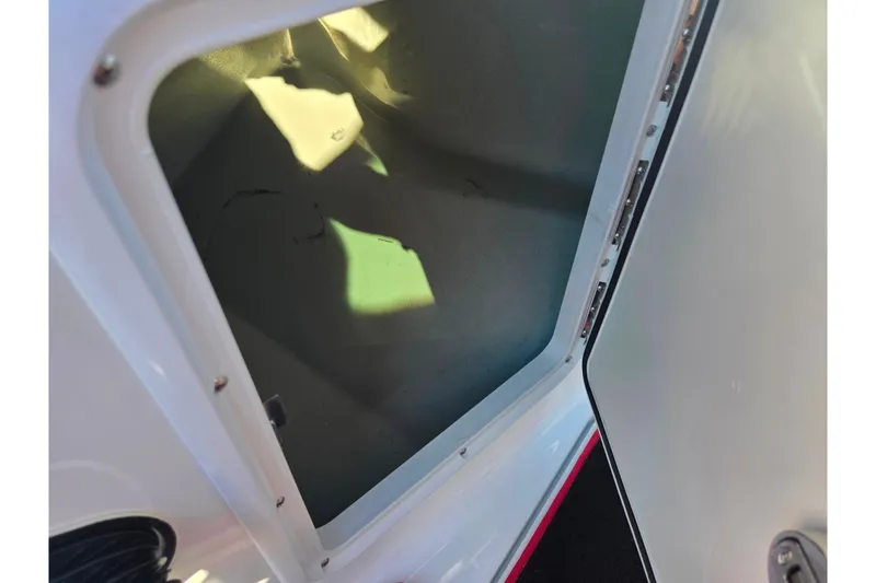 Slide: The Image of Open storage compartment in 2012 Sea-Doo Sport Boats 210 Wake. - 15