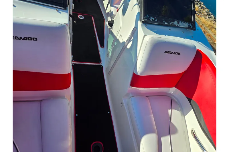 Slide: The Image of 2012 Sea-Doo 210 Wake boat interior with red and white seating. - 19