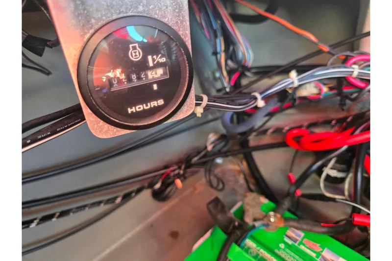 Slide: The Image of 2007 Larson LXi 228 hour meter and wiring detail. - 24