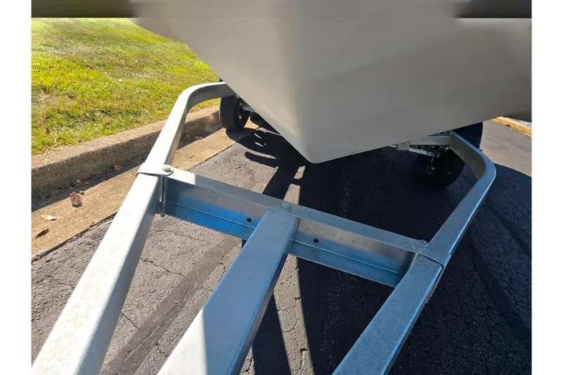 Slide: The Image of 2007 Larson LXi 228 boat on a trailer, parked on a sunny day. - 7